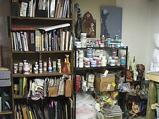 Studio - clean bookcase and glazes