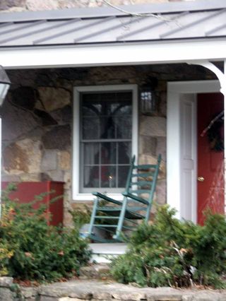 Cville blue rocking chair on porch