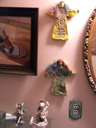 Art in my house bathroom WW and fairy candleholder